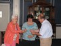 Past-President Sarah Lamothe receives her Paul Harris Fellowship Pin from PDG Ann Williams and her father Paul Broadmeadow.